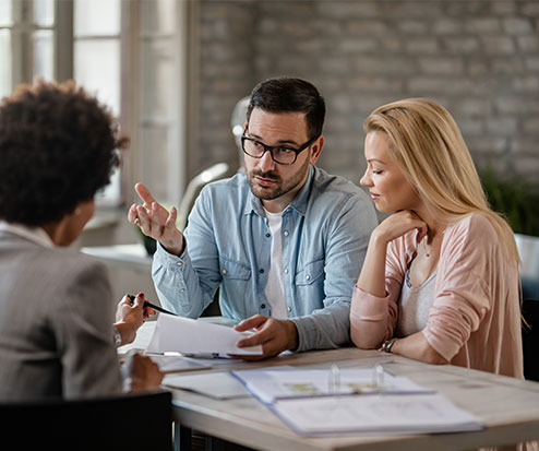 Insurance Agents Working at Their Office Desks